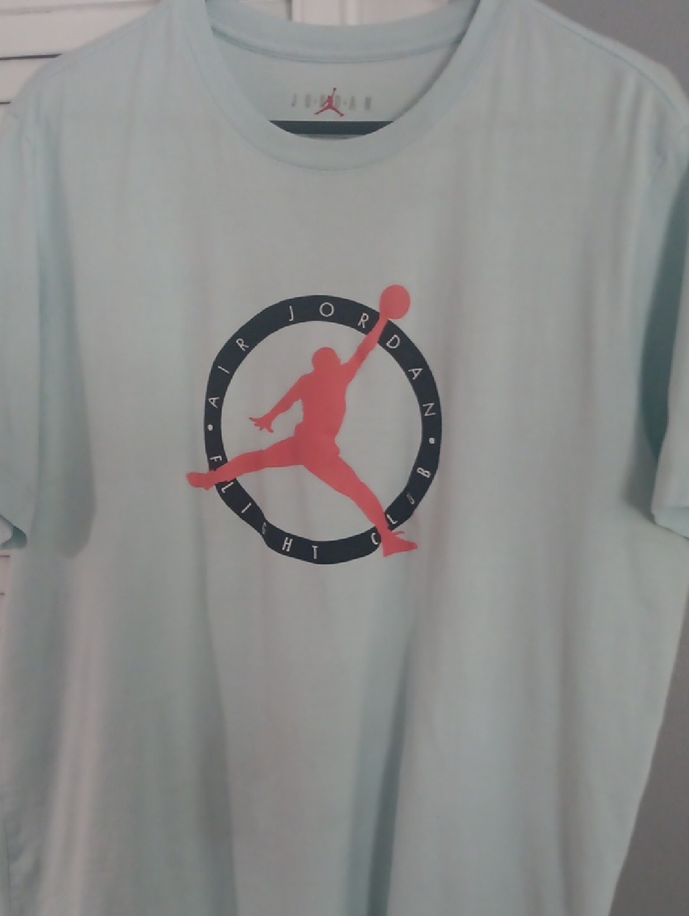 Jordan Men’s Light Blue Tee with Coral Jumpman Graphic